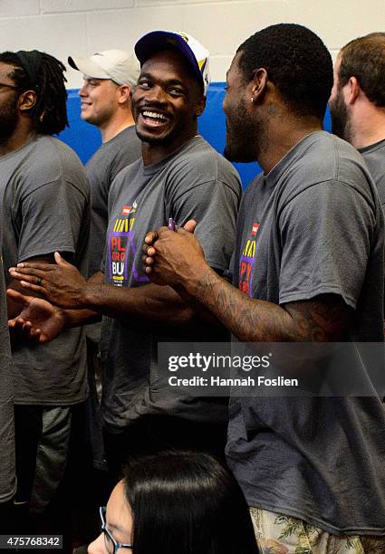 Adrian Peterson of the Minnesota Vikings smiles after the ribbon cutting ceremony during the 10th Annual Minnesota Vikings Playground Build on June...