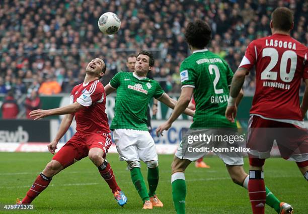 Petr Jiracek of Hamburg and Aleksandar Junuzovic of Bremen compete for the ball during the Bundesliga match between Werder Bremen and Hamburger SV at...