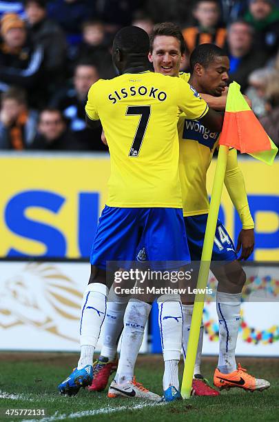 Loic Remy of Newcastle United is congratulated by Moussa Sissoko and Luuk de Jong as he scores their second goal during the Barclays Premier League...