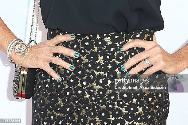 Actress Minnie Driver, bracelet and jewelry detail, attends the British Consul General hosted Theirworld collaboration with Astley Clarke summer...