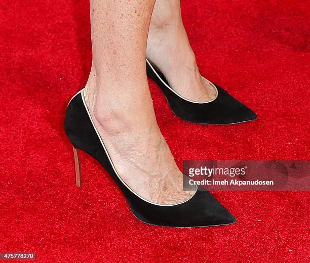 Actress Minnie Driver, shoe detail, attends the British Consul General hosted Theirworld collaboration with Astley Clarke summer reception at The...