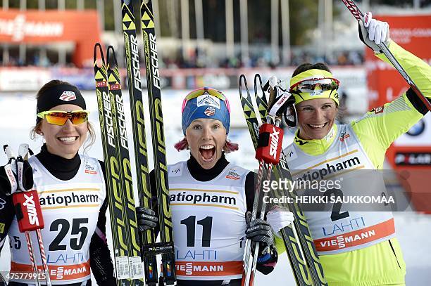 Winner US Kikkan Randall , 2nd placed Katja Visnar of Slovenia and 3rd placed Sophie Caldwell celebrate after competing in the Women's Cross-Country...