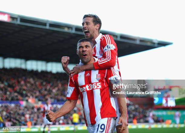 Jonathan Walters of Stoke City celebrates his goal with Peter Crouch during the Barclays Premier League match between Stoke City and Arsenal at...