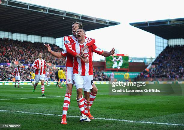 Jonathan Walters of Stoke City celebrates his goal with Peter Crouch during the Barclays Premier League match between Stoke City and Arsenal at...