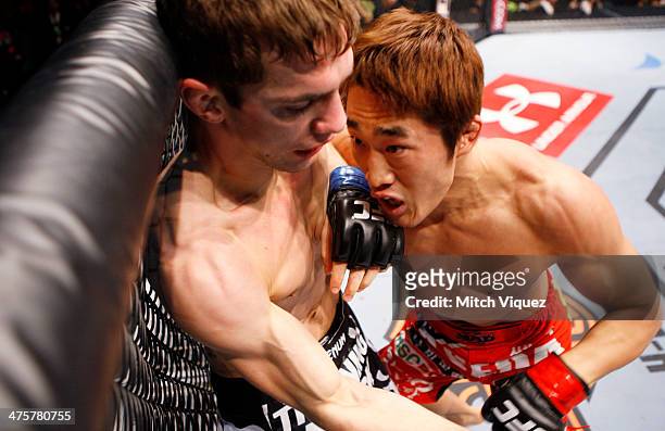 Dong Hyun Kim pushes John Hathaway against the cage in their welterweight fight during the UFC Fight Night event at the Venetian Macau on March 1,...
