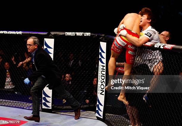 Dong Hyun Kim celebrates with his corner after knocking out John Hathaway in their welterweight fight during the UFC Fight Night event at the...