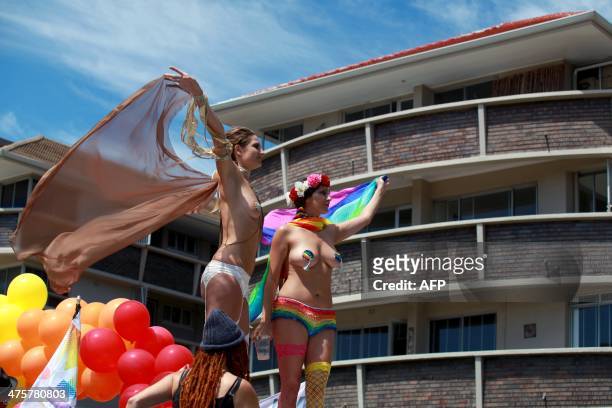 Float passes buildings as hundreds of people gathered on the streets of Green Point in Cape Town on March 1, 2014 to take part in the 2014 Gay Pride...