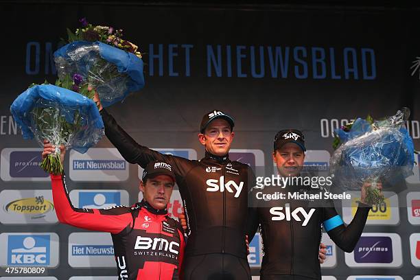 Ian Stannard of Great Britain and Team Sky celebrates first place alongside second placed Greg Van Avermaet of Belgium and BMC Racing Team and third...