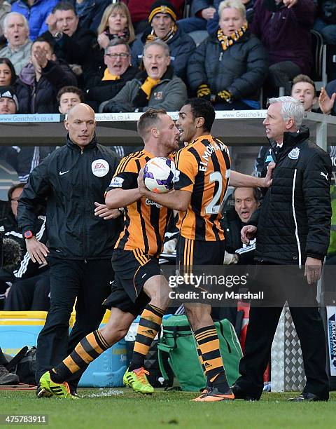 David Meyler of Hull City pushes Alan Pardew, manager of Newcastle United during the Barclays Premier League match between Hull City and Newcastle...