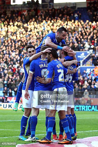 Leicester City's David Nugent is congratulated by Marcin Wasilewski and team mates on making it 3-0 during the Sky Bet Championship match between...