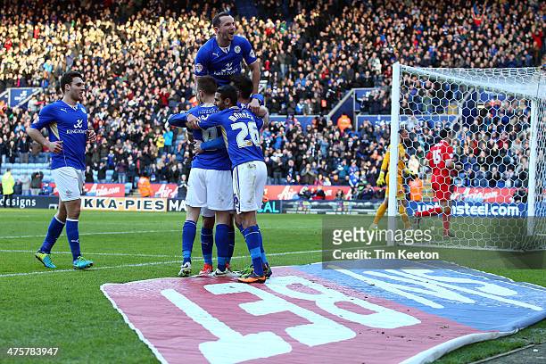 Leicester City's David Nugent is congratulated by Daniel Drinkwater and team mates on making it 3-0 during the Sky Bet Championship match between...