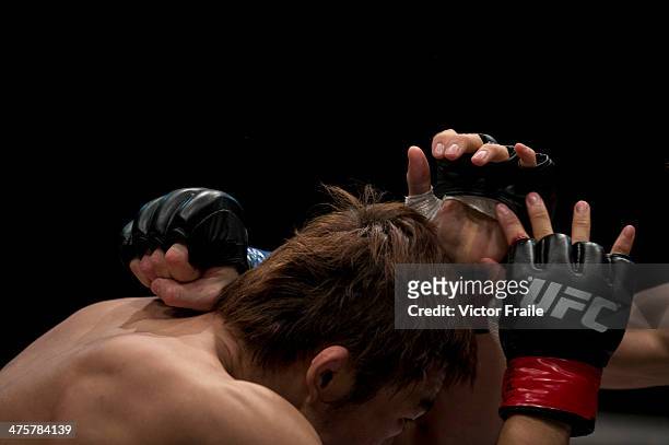 Dong Hyun Kim of South Korea and John Hathaway of England fight in their welterweight bout during the UFC Fight Night at the Cotai Arena on March 1,...