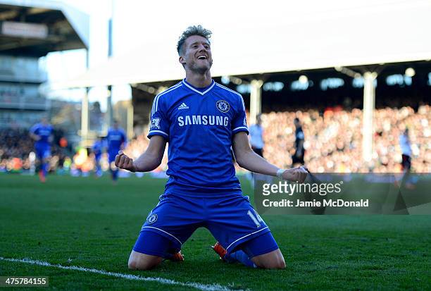 Andre Schurrle of Chelsea celebrates as he scores their third goal and completes his hat trick during the Barclays Premier League match between...