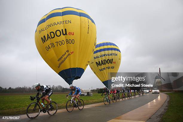 Tom Boonen of Belgium and Omega Pharma-Quick Step Cycling Team leads past balloons and a windmill during the Omloop Het Nieuwsblad on March 1, 2014...