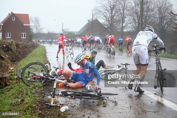 Riders crash in wet conditions during the Omloop Het Nieuwsblad on March 1, 2014 in Ghent, Belgium.