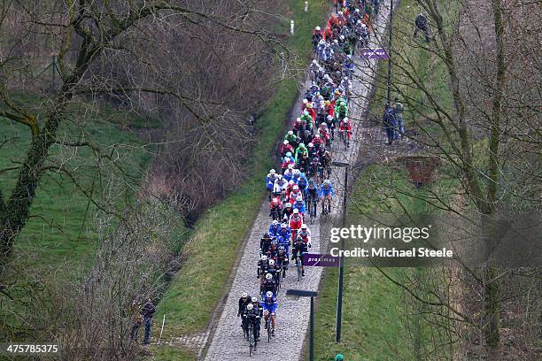 The peloton head through the cobbled lanes of Haaghoek during the Omloop Het Nieuwsblad on March 1, 2014 in Ghent, Belgium.