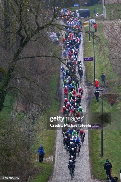 The peloton head through the cobbled lanes of Haaghoek during the Omloop Het Nieuwsblad on March 1, 2014 in Ghent, Belgium.