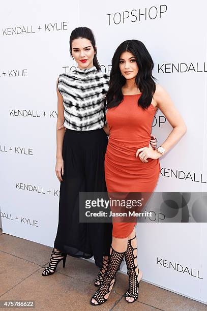 Kendall Jenner and Kylie Jenner attend a launch party for their Kendall + Kylie fashion line at TopShop on June 3, 2015 in Los Angeles, California.