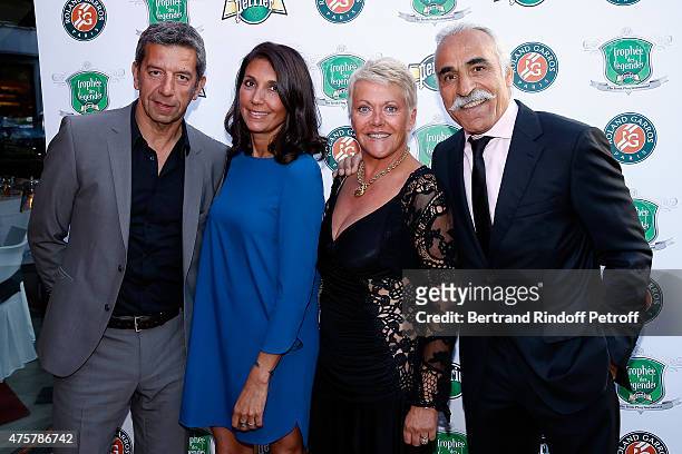 Doctor Michel Cymes and his wife Nathalie, Mansour Bahrami and wife Frederique attend the Trophee des Legendes Dinner at Le Fouquet's, champs Elysees...