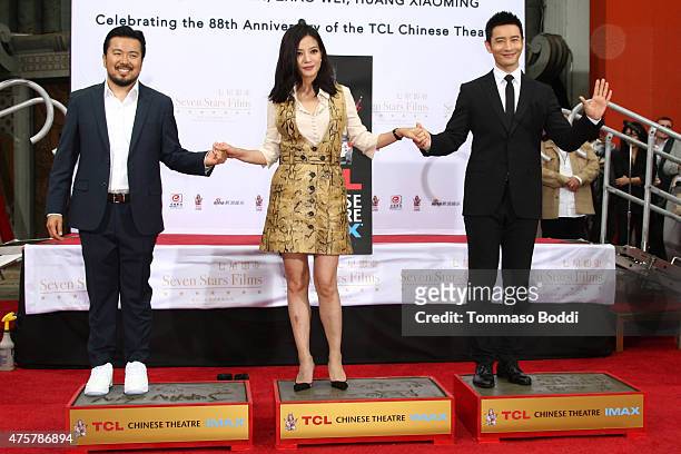 Director Justin Lin, actors Zhao Wei and Huang Xiaoming are honored with hand/footprint ceremony during the 88th Birthday Commemoration Of TCL...