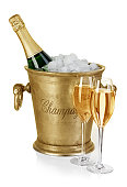 Bottle of champagne  in ice bucket with stemware isolated