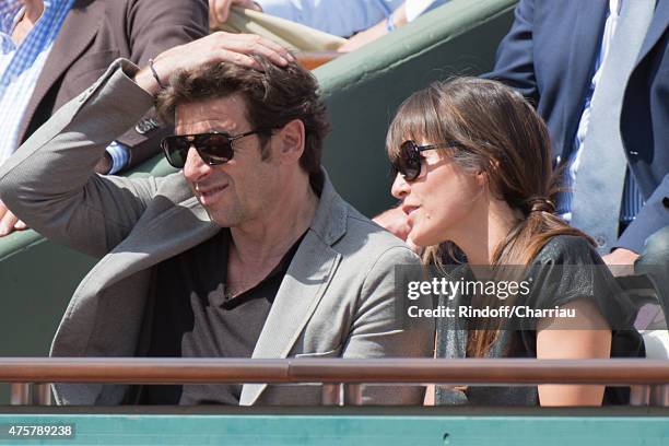 Patrick Bruel and Caroline Nielsen attend the French open at Roland Garros on June 3, 2015 in Paris, France.