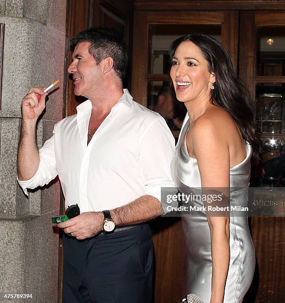 Simon Cowell and Lauren Silverman leaving the Banqueting House, Whitehall on June 3, 2015 in London, England.