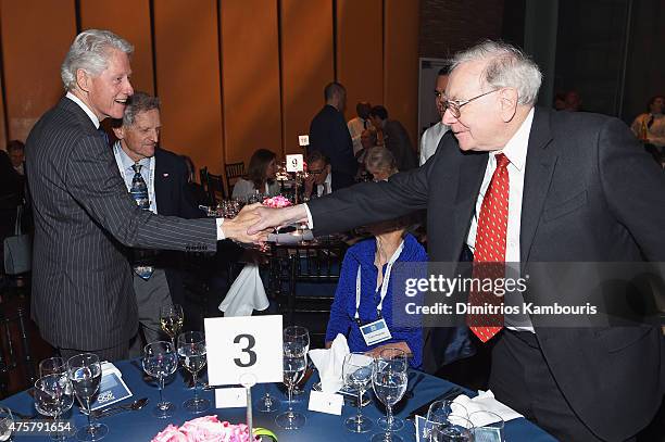 Former President Bill Clinton and Warren Buffett attend the Forbes' 2015 Philanthropy Summit Awards Dinner on June 3, 2015 in New York City.