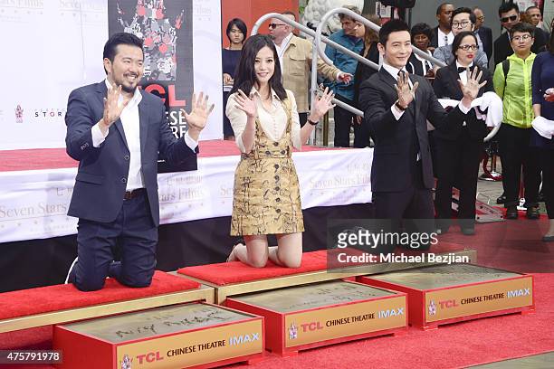 Film Director Justin Lin, Actress Zhao Wei and Actor Huang Xiaoming participate in the TCL Chinese Theatre Hand & Footprint Ceremony at Bruno Wu and...