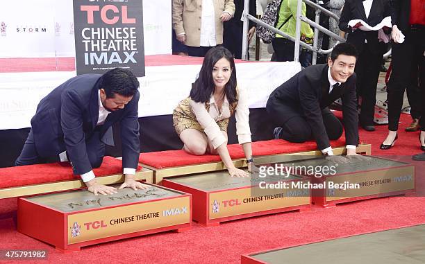 Film Director Justin Lin, Actress Zhao Wei and Actor Huang Xiaoming participate in the TCL Chinese Theatre Hand & Footprint Ceremony at Bruno Wu and...