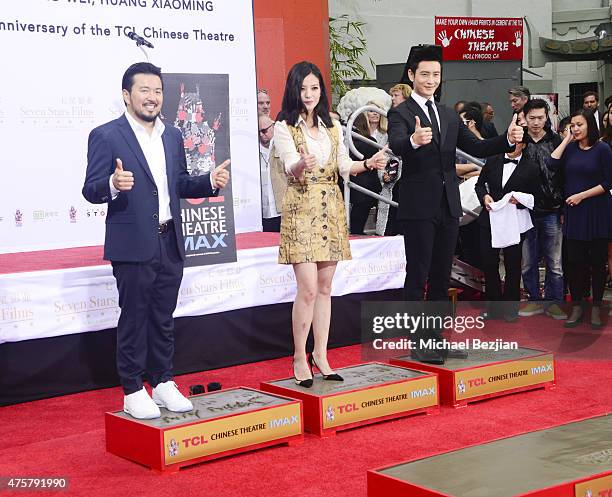 Film Director Justin Lin, Actress Zhao Wei and Actor Huang Xiaoming participate in the TCL Chinese Theatre Hand & Footprint Ceremony at Bruno Wu and...