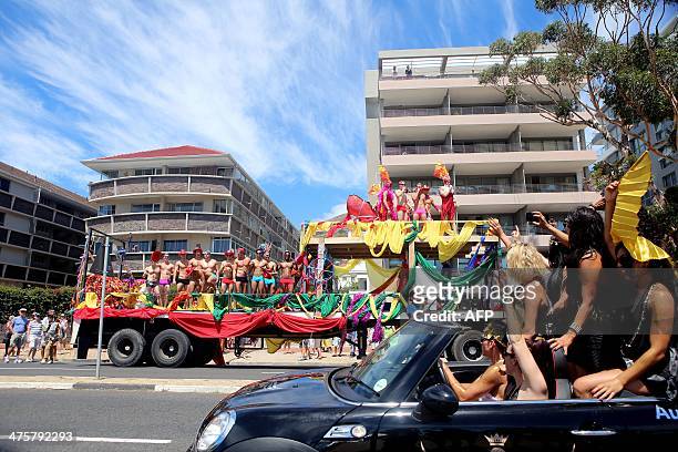 Floats pass each other as hundreds of people gathered on the streets of Green Point in Cape Town, on March 1 to take part in the 2014 Gay Pride...