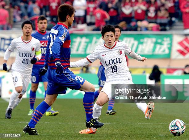 Naoaki Aoyama of Ventforet Kofu and Yuta Toyokawa of Kashima Antlers compete for the ball during the J.League match between Ventforet Kofu and...