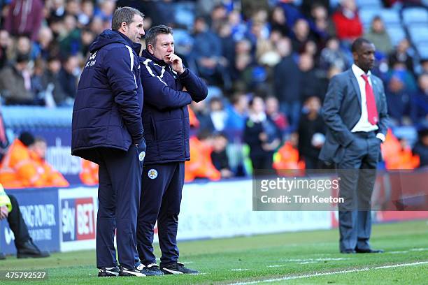 Leicester City's Mike Stowell, Goalkeeper Coach and Assistant Manager, Craig Shakespeare share a secret out of ear shot of Charlton Athletic's...