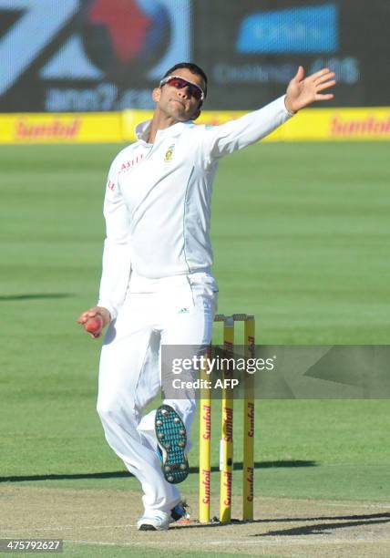 Duminy of South Africa bowls on day 1 of the third Test match between South Africa and Australia at Newlands in Cape Town on March 1, 2014. AFP PHOTO...