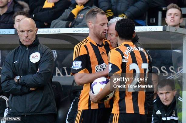 David Meyler of Hull City clashes with Alan Pardew, Manager of Newcastle United during the Barclays Premier League match between Hull City and...