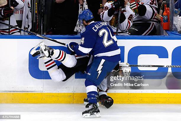 Ryan Callahan of the Tampa Bay Lightning checks Johnny Oduya of the Chicago Blackhawks in the second period during Game One of the 2015 NHL Stanley...