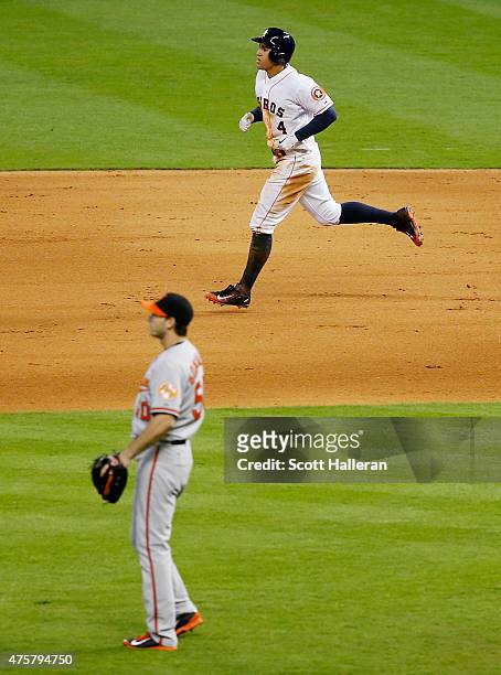 George Springer of the Houston Astros trots around the bases after hitting a solo home run off Miguel Gonzalez of the Baltimore Orioles in the sixth...