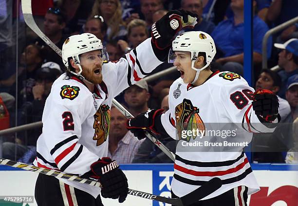 Teuvo Teravainen celebrates his third period goal with Duncan Keith of the Chicago Blackhawks against the Tampa Bay Lightning during Game One of the...
