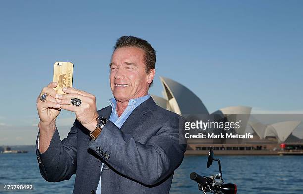 Arnold Schwarzenegger takes a selfie during a 'Terminator Genisys' photo call at the Park Hyatt Sydney on June 4, 2015 in Sydney, Australia.