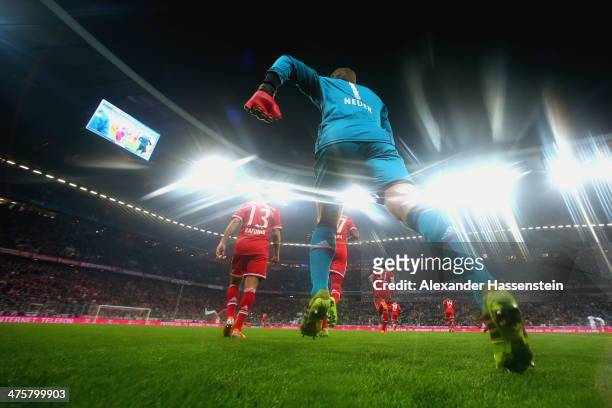 Manuel Neuer, keeper of Muenchen enters the field with his team mates for the Bundesliga match between FC Bayern Muenchen and FC Schalke 04 at...