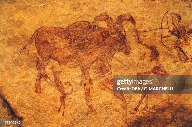 Archers, dogs and a hoofed animal, cave painting, Tassili n'Ajjer , Algeria.