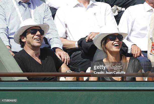 Patrick Bruel and his girlfriend Caroline Nielsen attend day 11 of the French Open 2015 at Roland Garros stadium on June 3, 2015 in Paris, France.