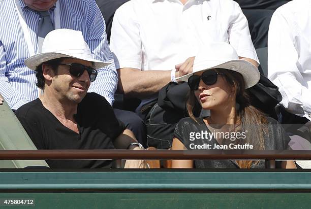 Patrick Bruel and his girlfriend Caroline Nielsen attend day 11 of the French Open 2015 at Roland Garros stadium on June 3, 2015 in Paris, France.