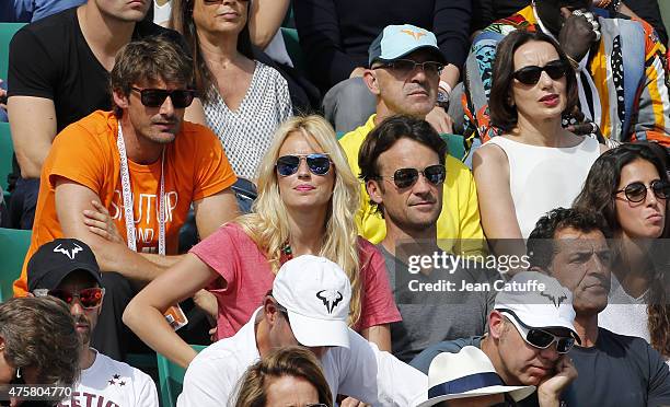 Juan Carlos Ferrerro, Carlos Moya and his wife Carolina Cerezuela, Luz Casal attend day 11 of the French Open 2015 at Roland Garros stadium on June...