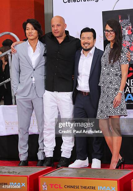 Sung Kang, Vin Diesel, Justin Lin and Jordana Brewster attend the "Hand and Footprint Ceremony" at The TCL Chinese Theatre IMAX on June 3, 2015 in...