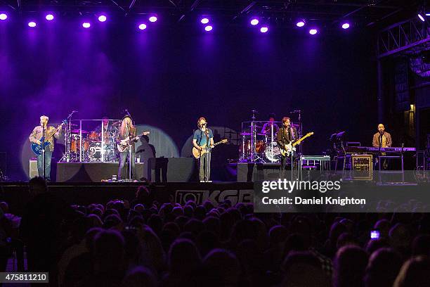 Musicians John Cowan, Ed Toth, Pat Simmons, Tom Johnston, Tony Pia, John McFee and Guy Allison of The Doobie Brothers perform on stage at Humphrey's...