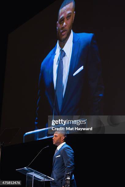 Robinson Cano of the Seattle Mariners speaks on stage during the Canoche Benefit for the RC22 Foundation at the Paramount Theatre on June 3, 2015 in...