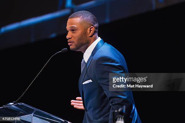 Robinson Cano of the Seattle Mariners speaks on stage during the Canoche Benefit for the RC22 Foundation at the Paramount Theatre on June 3, 2015 in...