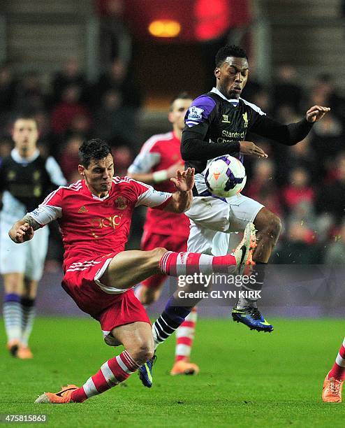 Liverpool's English striker Daniel Sturridge vies for the ball with Southampton's Croatian defender Dejan Lovren during the English Premier League...